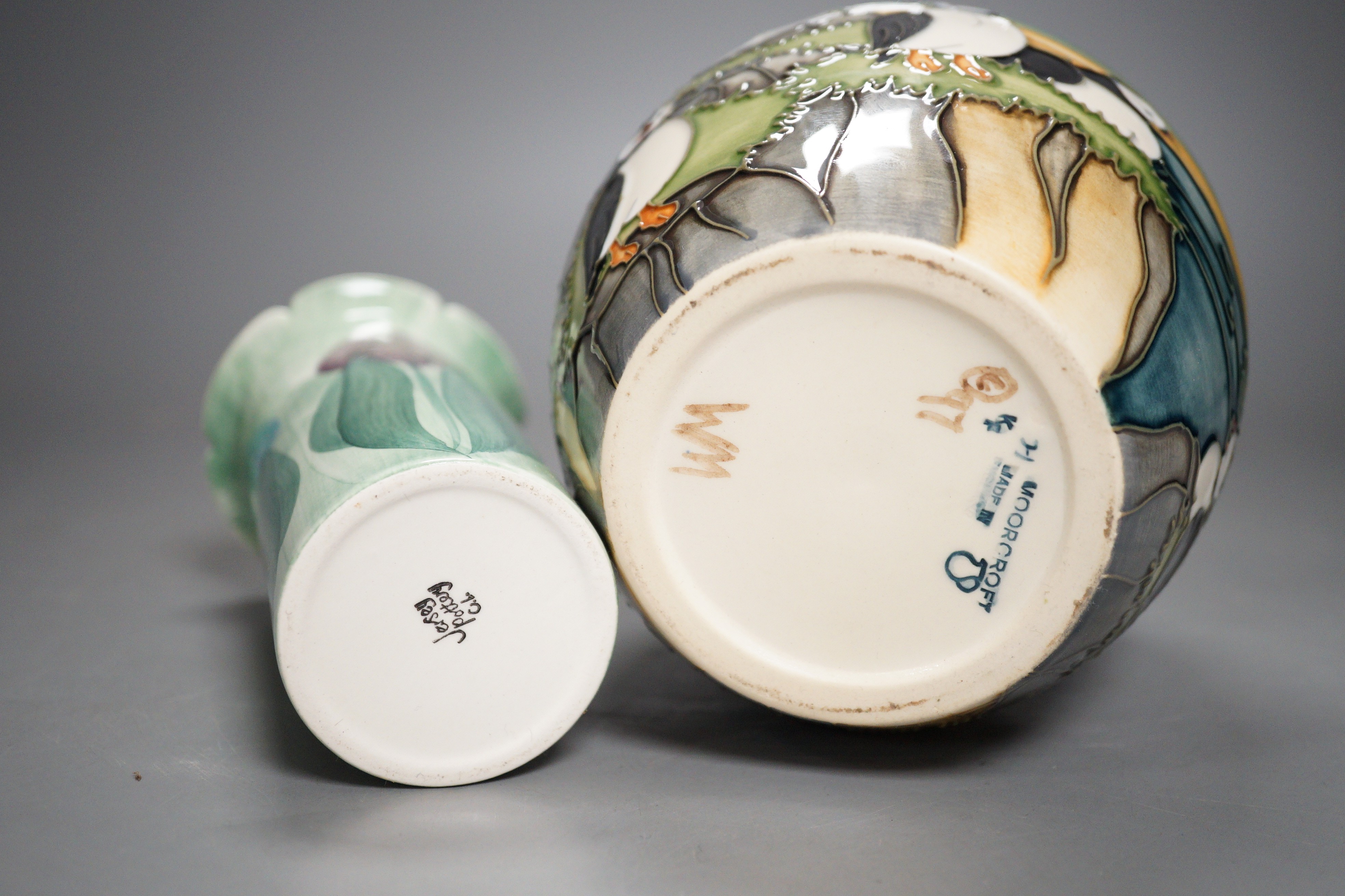 A Moorcroft pottery jar, decorated with puffins and a Jersey pottery 